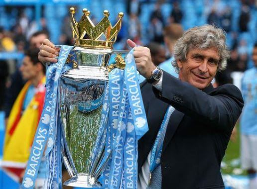 Carola Pucci husband Manuel Pellegrini with his trophy.